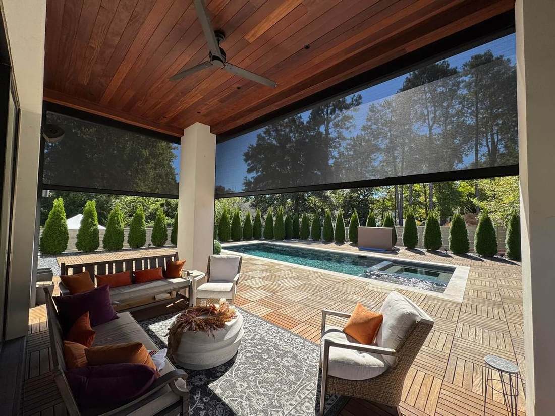 Slatted aluminum privacy wall around an outdoor room