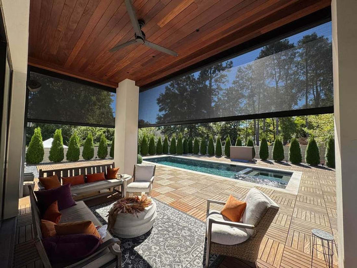 Slatted aluminum privacy wall around an outdoor room